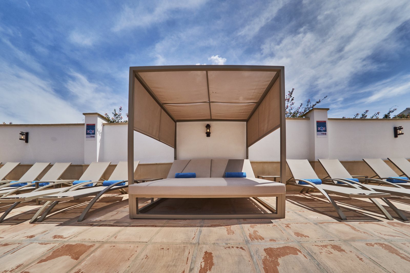 Canopied daybed at the edge of the saltwater pool