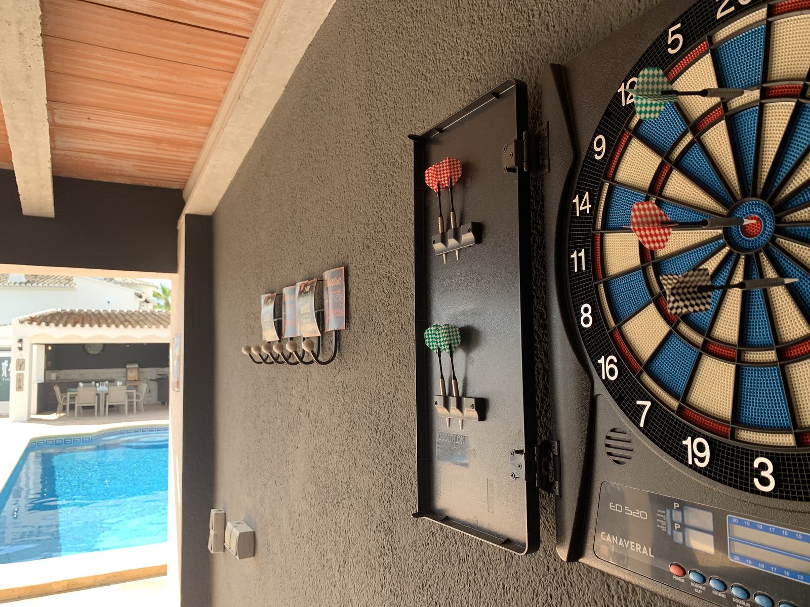 The electronic dart board in the games area
