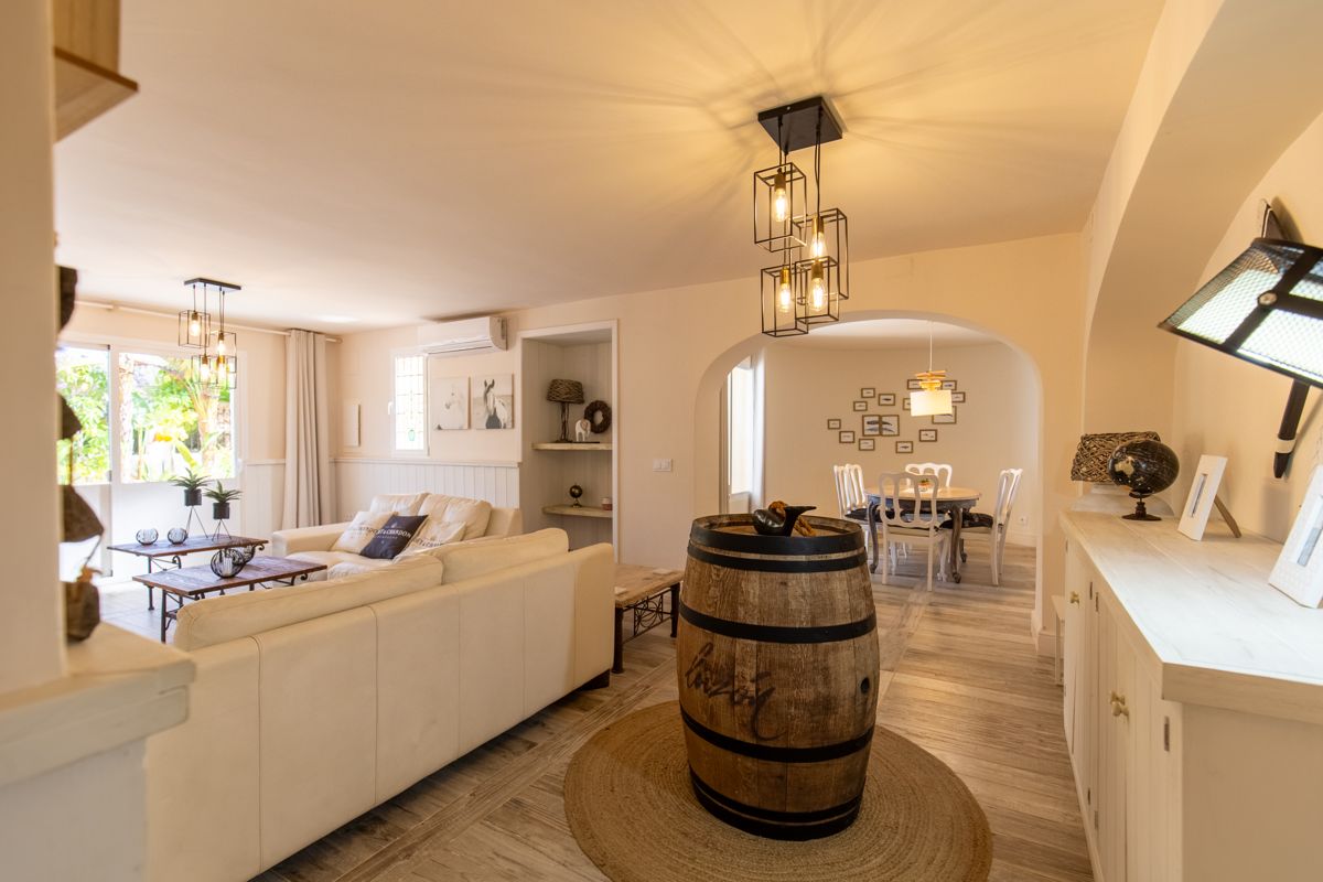 Living room with a wine barrel as a table — 20,000 Leagues Under the Sea, wing two of Villa Palmview, Jávea