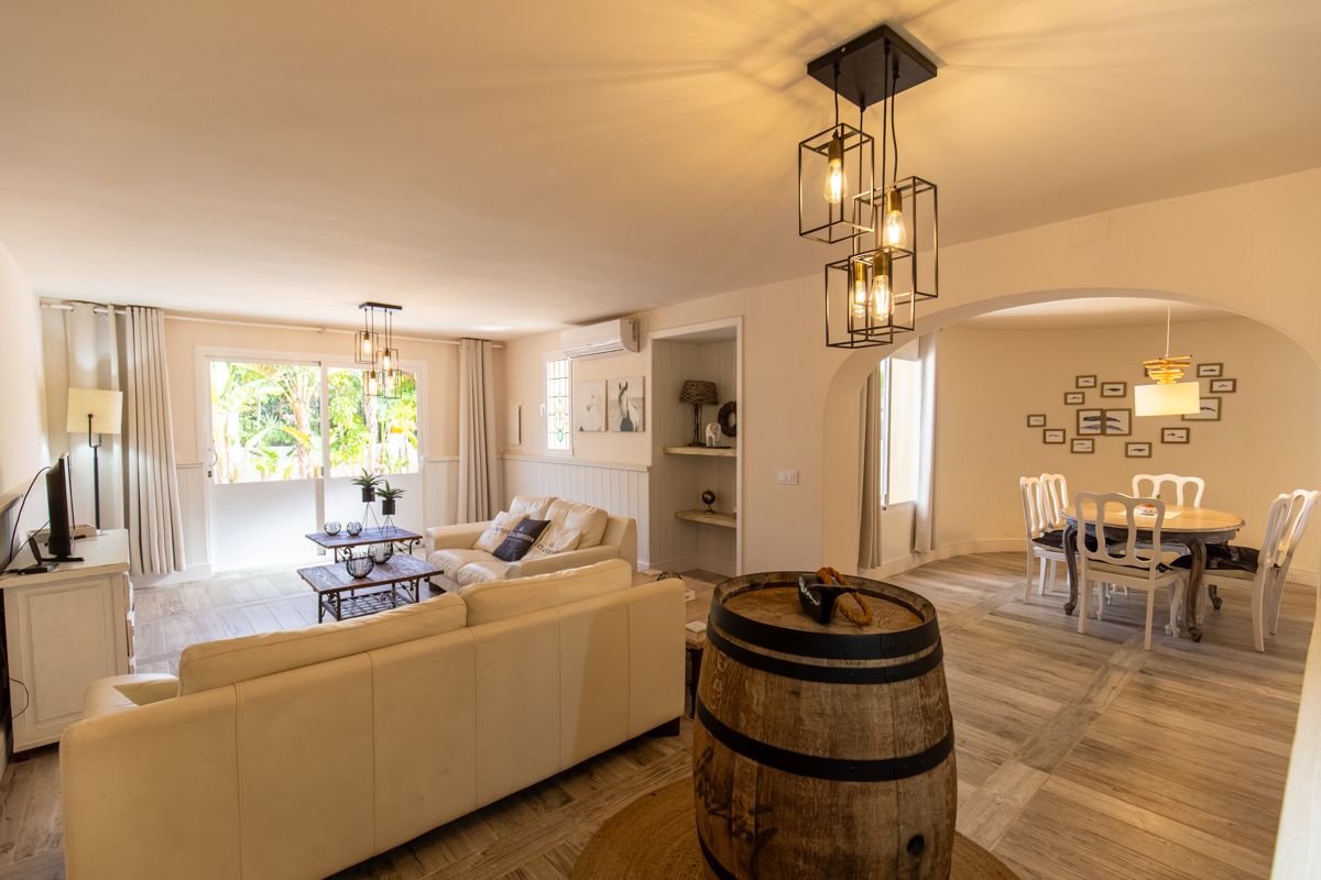 Living room looking through to the dining corner — 20,000 Leagues Under the Sea, wing two of Villa Palmview, Jávea