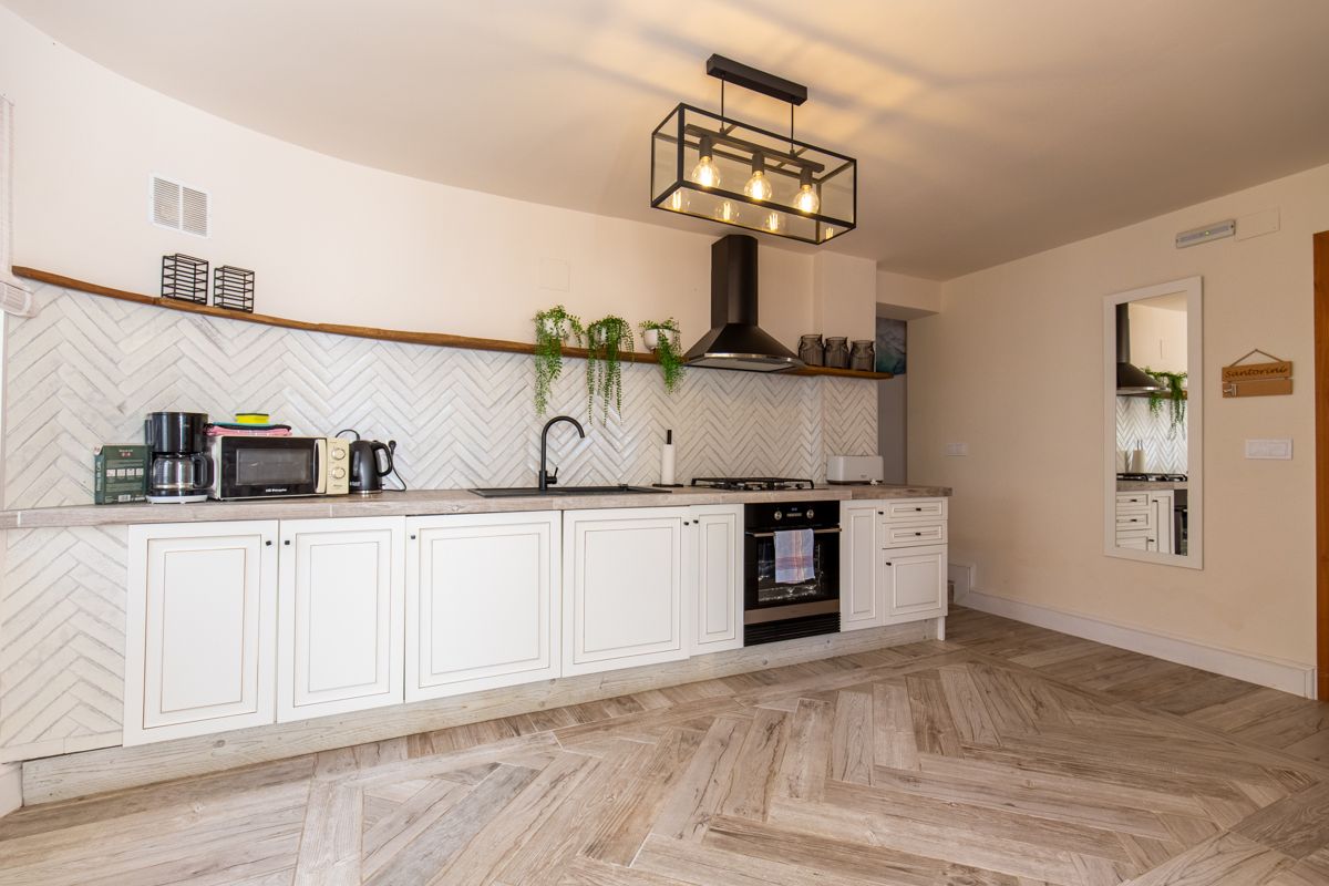 White kitchen with herringbone floor — 20,000 Leagues Under the Sea, wing two of Villa Palmview, Jávea