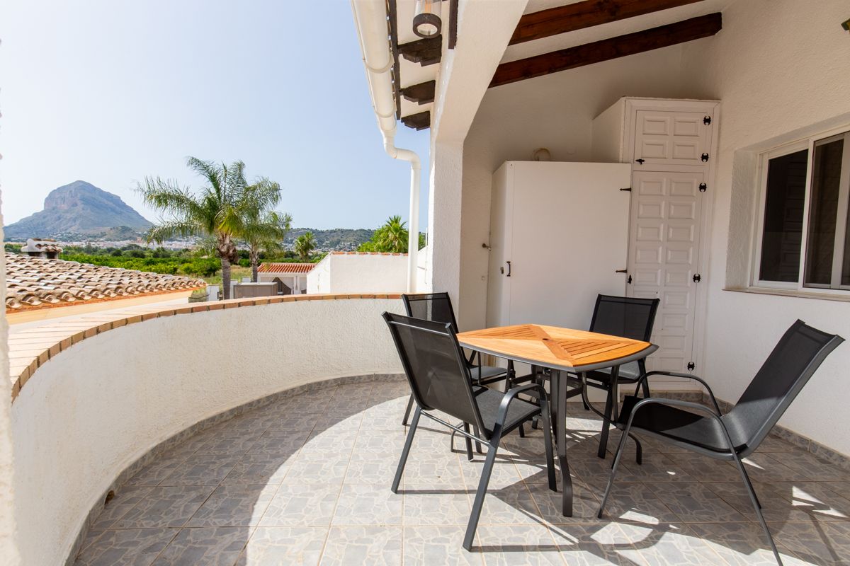 Terrace with table and a view of the Montgó — Mystique Travels, wing three of Villa Palmview, Jávea