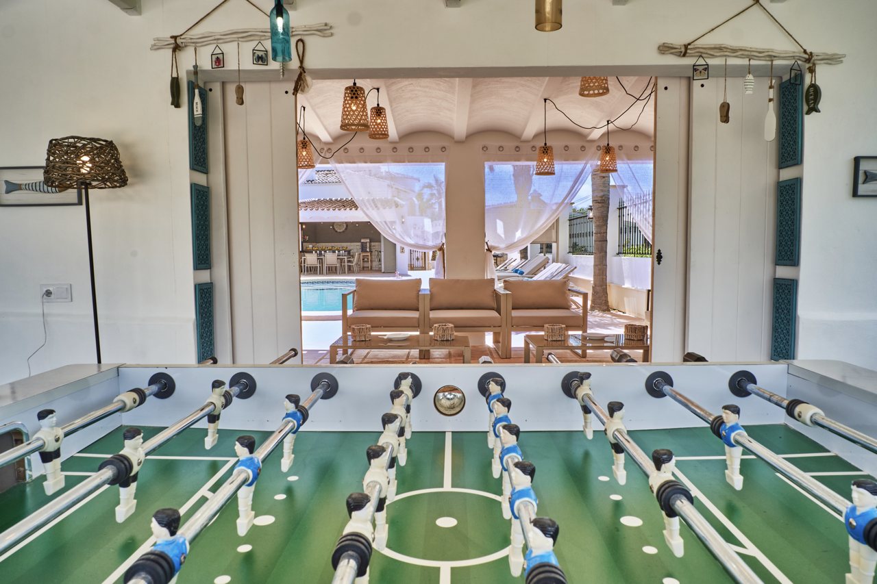 Table football in the covered games area beside the pool