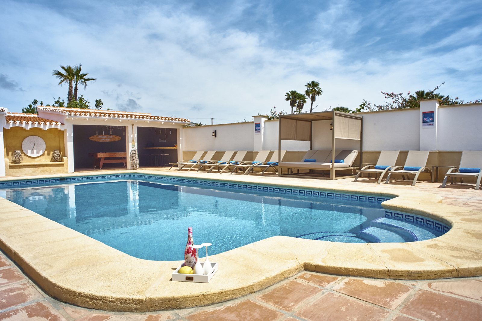 The large saltwater pool with cabanas and sun loungers